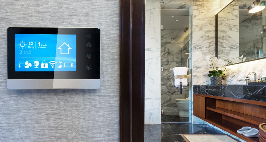 Smart home touchscreen on wall outside bathroom